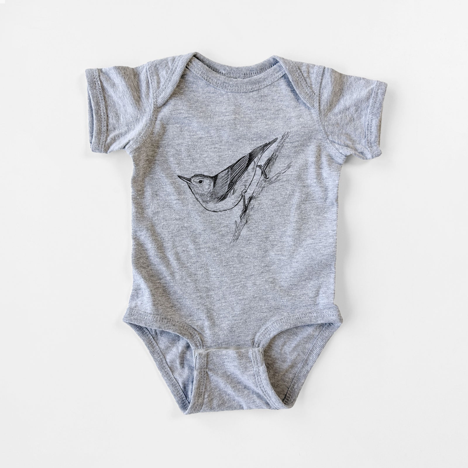 Grey baby bodysuit laid flat, printed with a detailed black ink sketch of a nuthatch clinging to a branch.