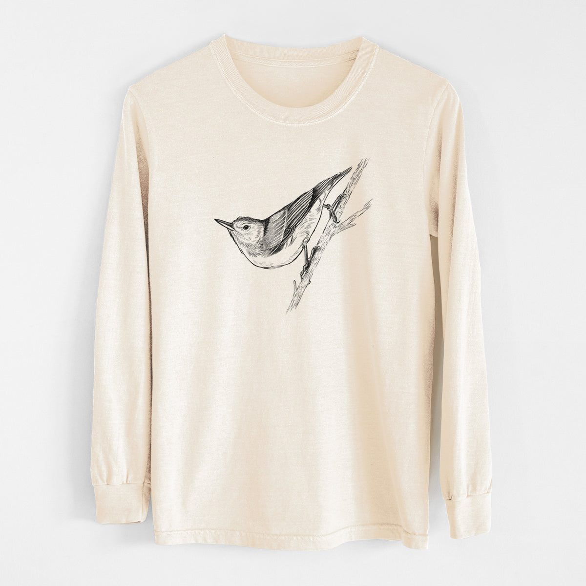 Ivory Comfort Colors long sleeve shirt laid flat, printed with a detailed black ink sketch of a nuthatch clinging to a branch.