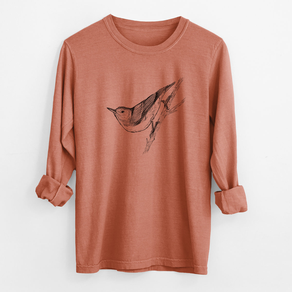 Yam burnt orange Comfort Colors long sleeve shirt laid flat with the cuffs rolled, printed with a detailed black ink sketch of a nuthatch clinging to a branch.