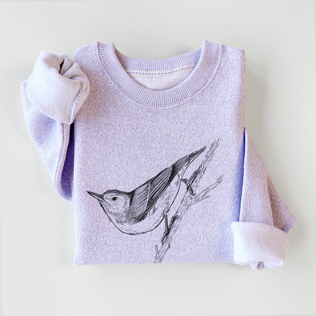 Ice purple knit sweatshirt printed with a detailed black ink sketch of a nuthatch clinging to a branch, styled flat.