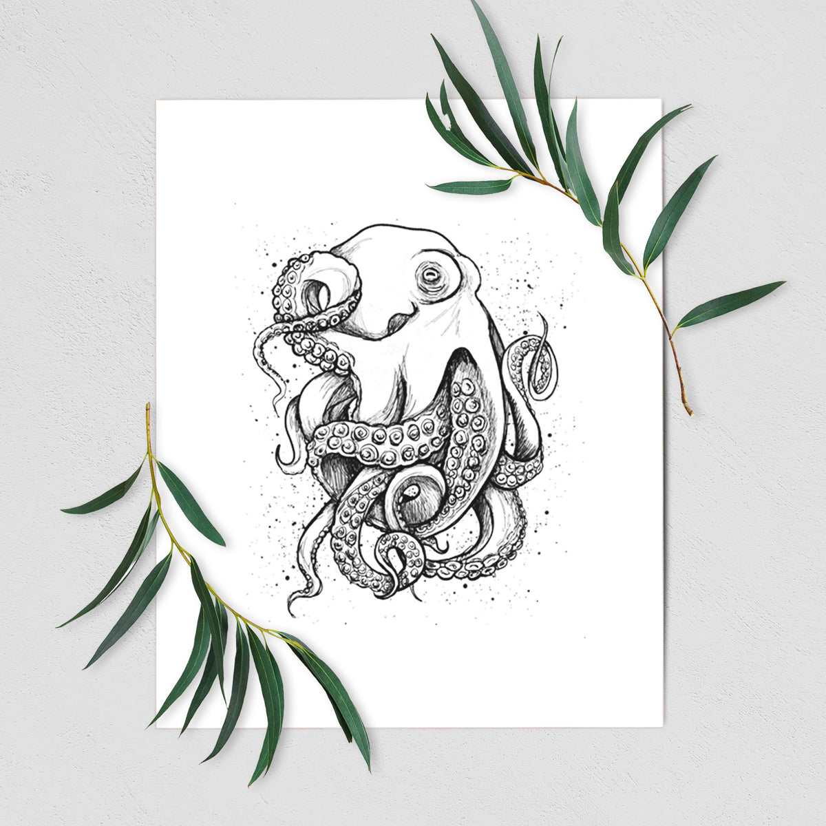 Art print of a detailed black ink illustration of a common octopus with curling tentacles, shown with eucalyptus leaves.