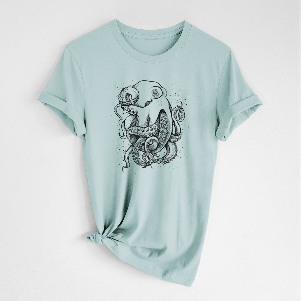 Dusty blue lightweight cotton t-shirt laid flat with the sleeves rolled, printed with a detailed black ink illustration of a common octopus with curling tentacles.