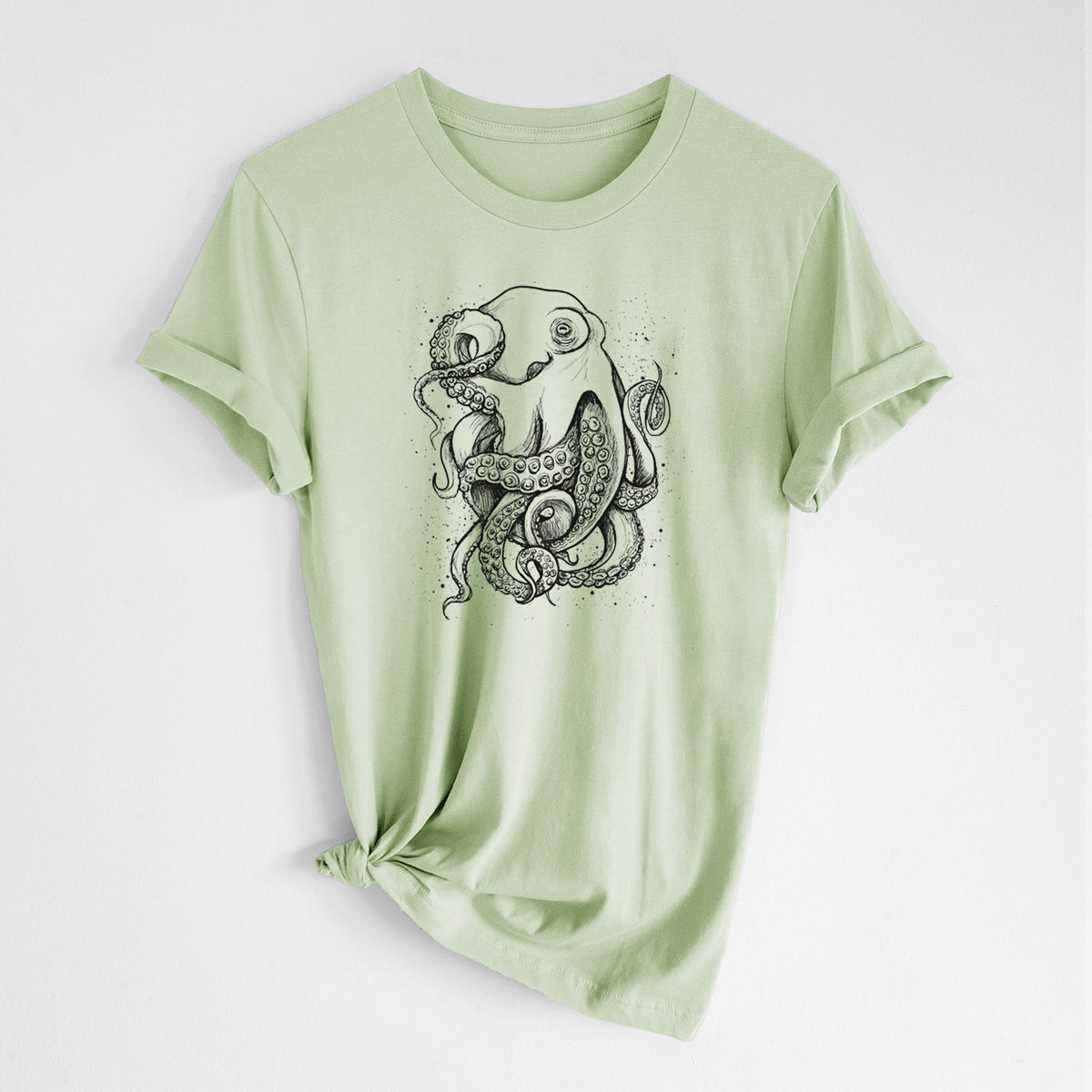 Spring green lightweight cotton t-shirt laid flat with the sleeves rolled, printed with a detailed black ink illustration of a common octopus with curling tentacles.
