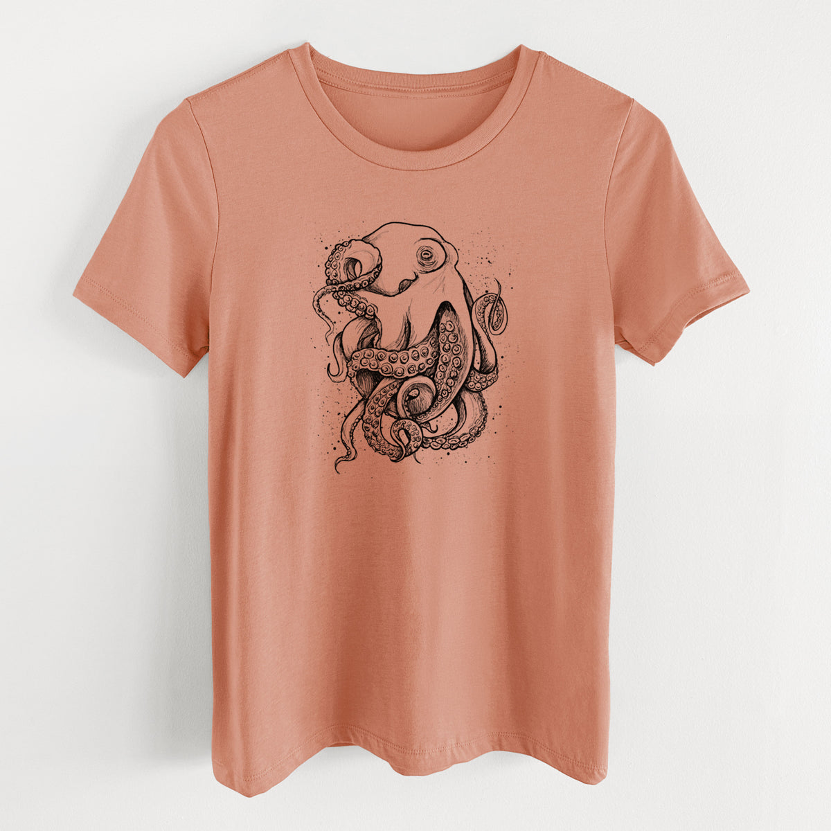 Terracotta orange women's relaxed fit cotton t-shirt laid flat, printed with a detailed black ink illustration of a common octopus with curling tentacles.