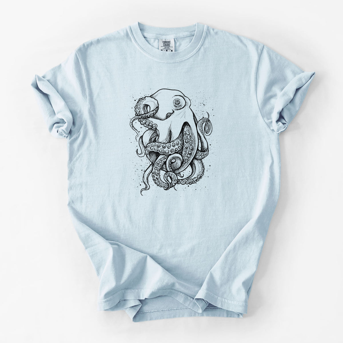 Chambray blue Comfort Colors t-shirt laid flat, printed with a detailed black ink illustration of a common octopus with curling tentacles.