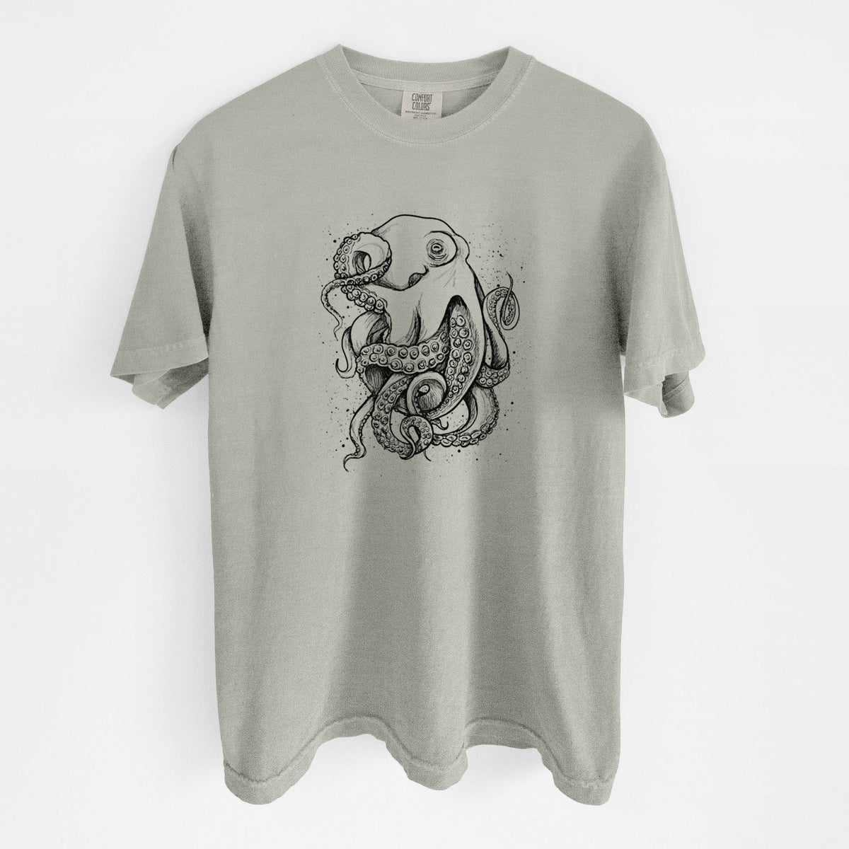 Sandstone beige Comfort Colors t-shirt laid flat, printed with a detailed black ink illustration of a common octopus with curling tentacles.
