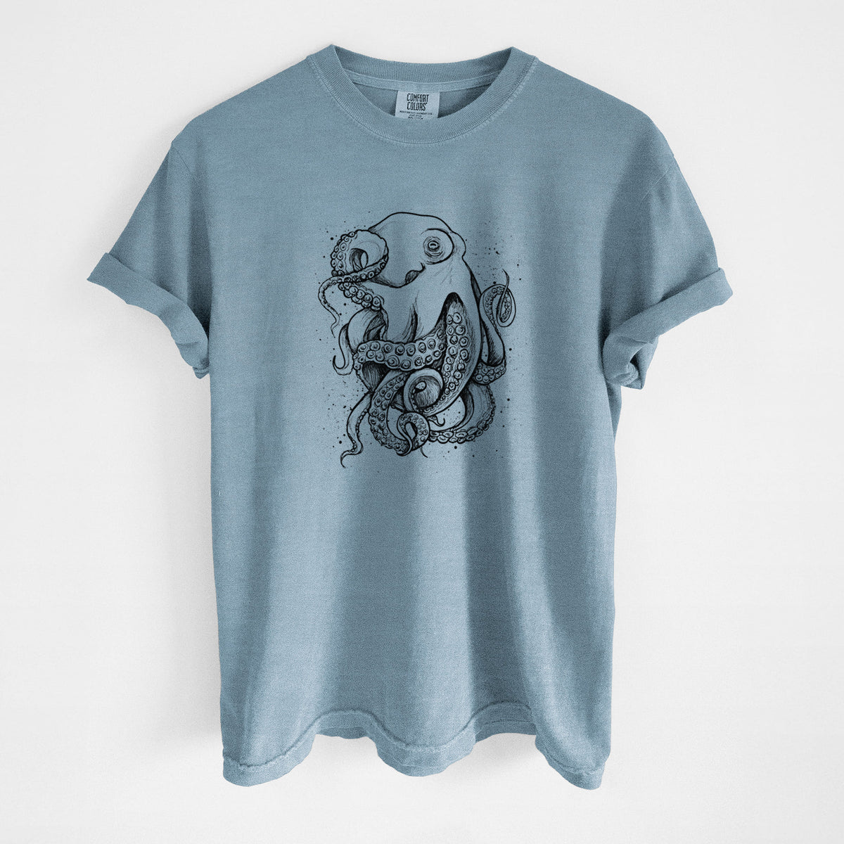 Steel blue Comfort Colors t-shirt laid flat, printed with a detailed black ink illustration of a common octopus with curling tentacles.