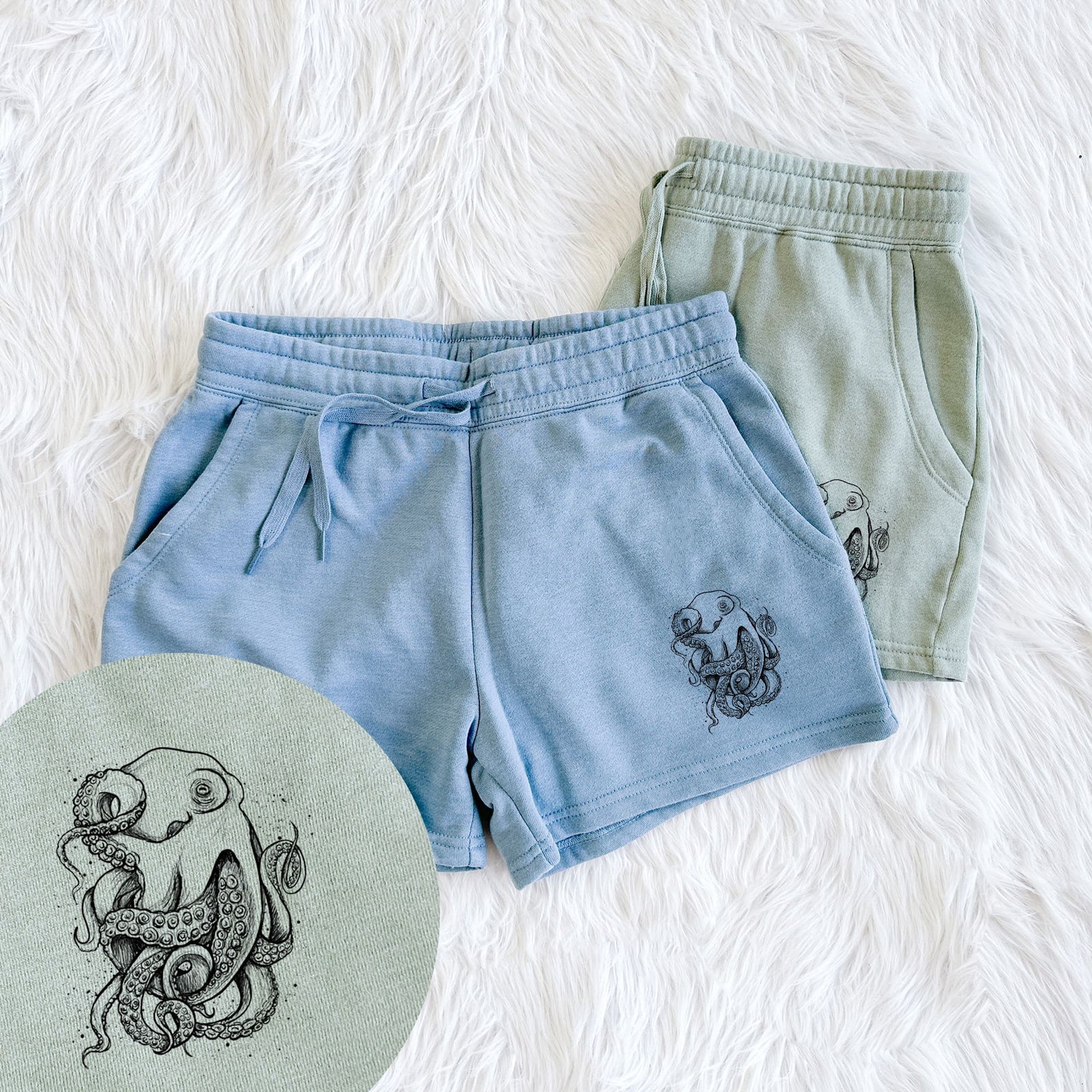 Two pairs of Cali Wave shorts in different colors printed with a detailed black ink illustration of a common octopus with curling tentacles, with a close-up of the print.
