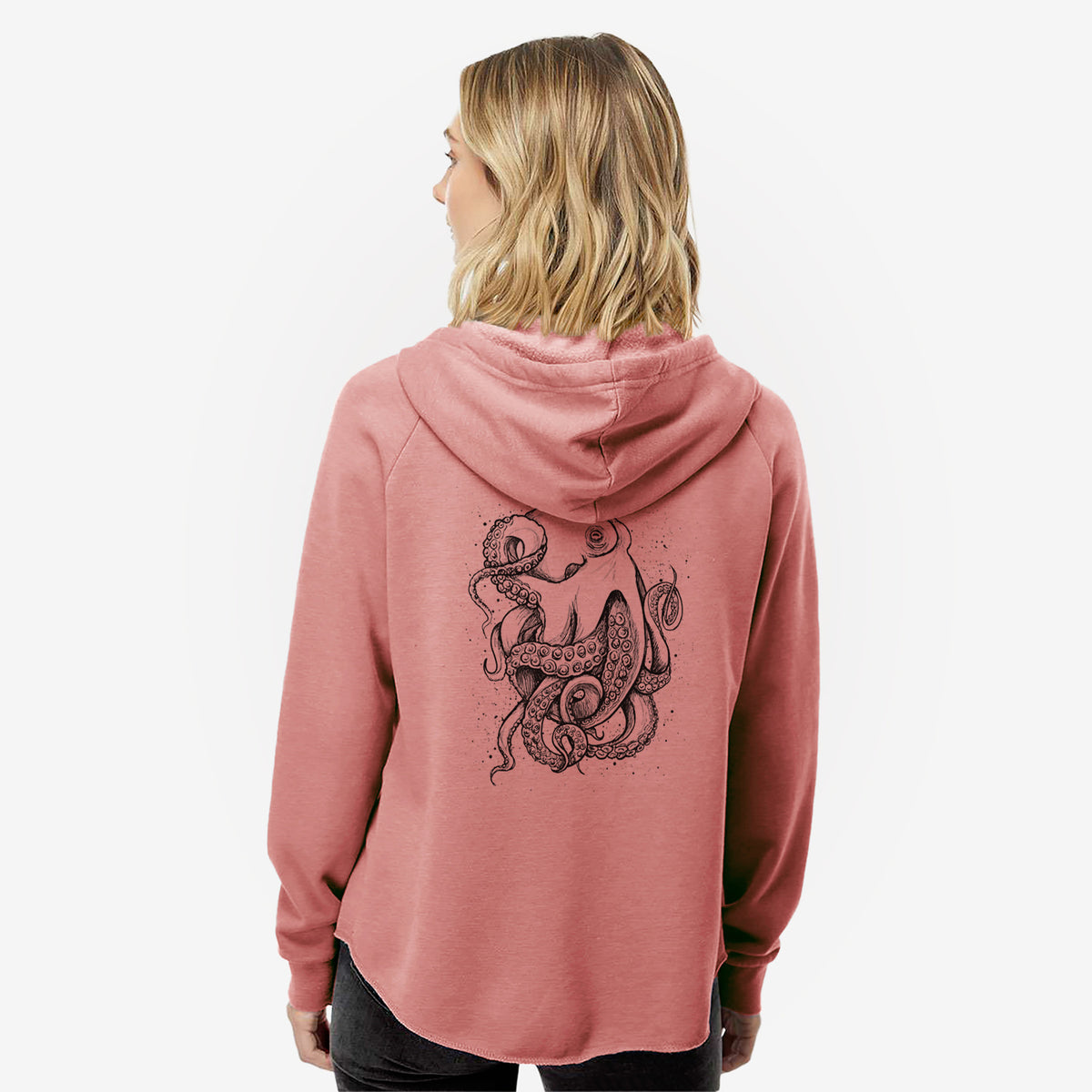 Woman wearing a dusty rose women's Cali Wave zip-up sweatshirt printed with a detailed black ink illustration of a common octopus with curling tentacles, seen from behind.