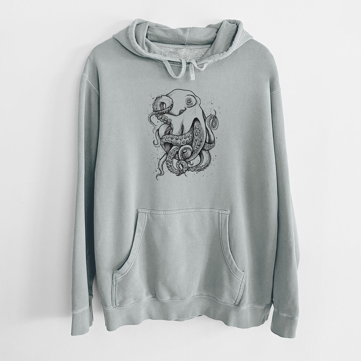 Sage green pigment dyed hoodie laid flat, printed with a detailed black ink illustration of a common octopus with curling tentacles.