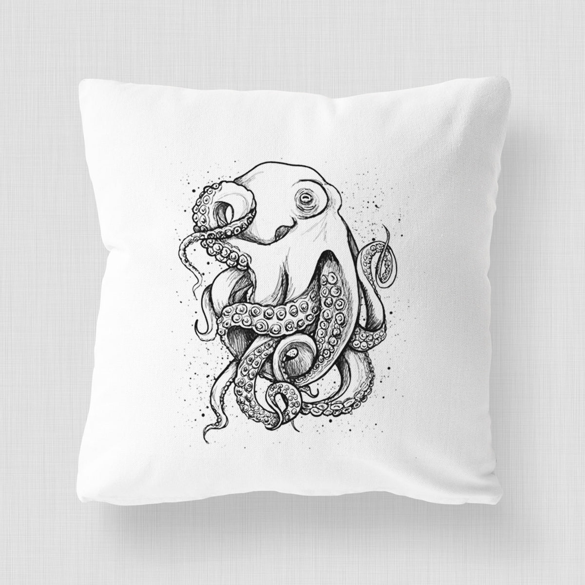 White pillow cover printed with a detailed black ink illustration of a common octopus with curling tentacles.