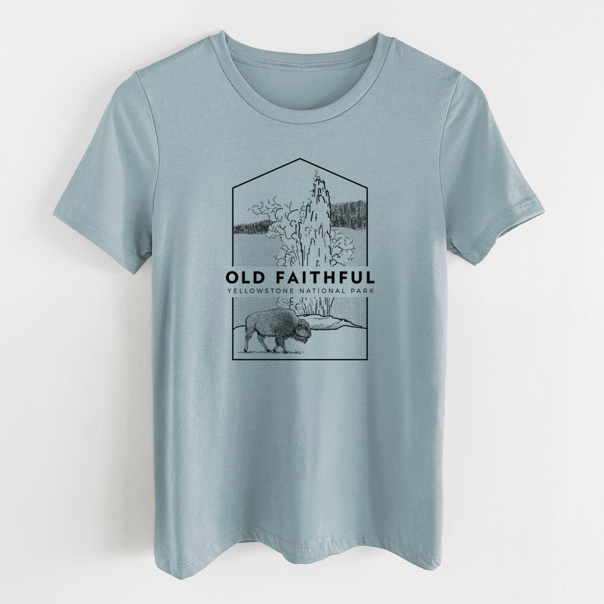 Vintage denim women's relaxed fit cotton t-shirt laid flat, printed with a black line art badge of the Old Faithful geyser erupting with a bison nearby, with the words Old Faithful, Yellowstone National Park.