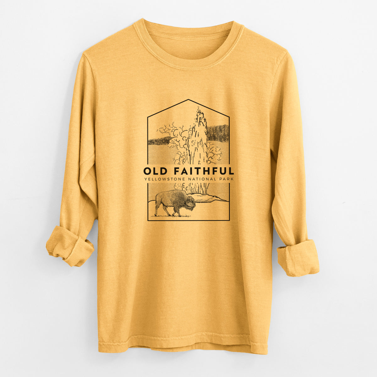 Golden wheat yellow Comfort Colors long sleeve shirt laid flat with the cuffs rolled, printed with a black line art badge of the Old Faithful geyser erupting with a bison nearby, with the words Old Faithful, Yellowstone National Park.