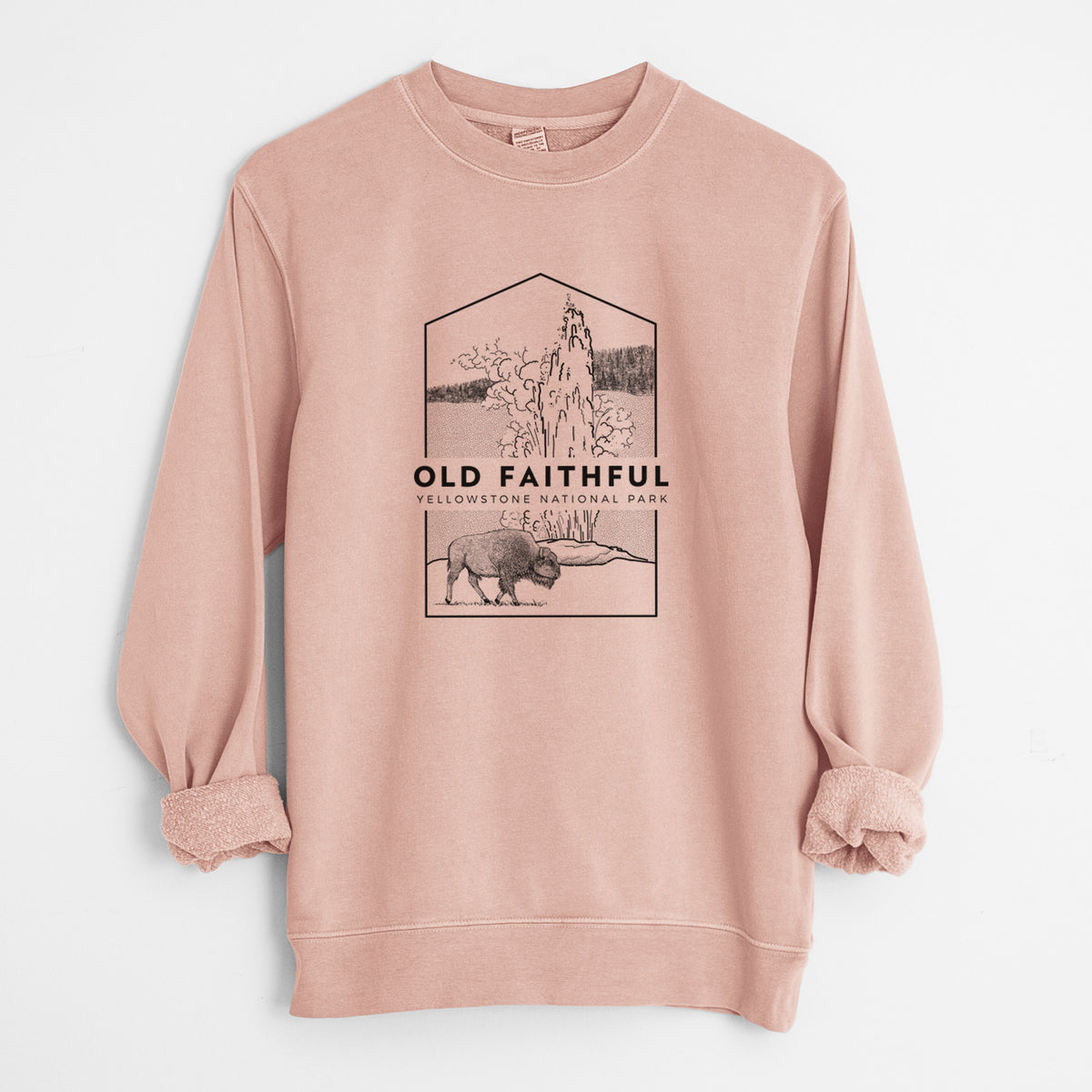 Dusty pink pigment dyed crewneck sweatshirt laid flat with the sleeves rolled, printed with a black line art badge of the Old Faithful geyser erupting with a bison nearby, with the words Old Faithful, Yellowstone National Park.