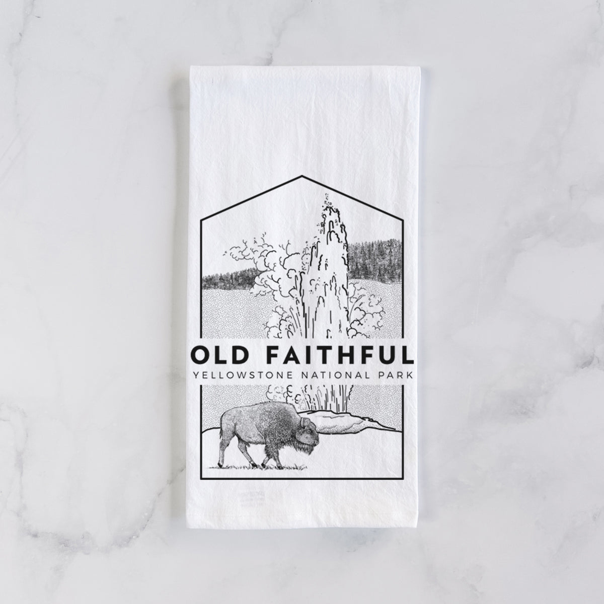 White cotton tea towel laid flat on marble, printed with a black line art badge of the Old Faithful geyser erupting with a bison nearby, with the words Old Faithful, Yellowstone National Park.