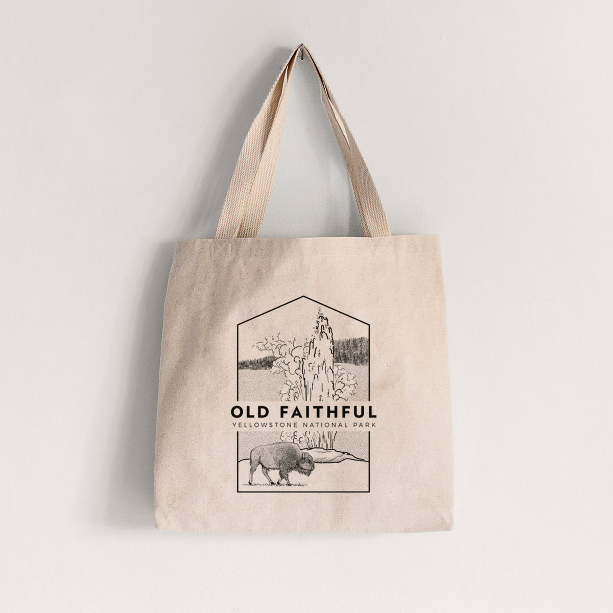 Natural canvas tote bag printed with a black line art badge of the Old Faithful geyser erupting with a bison nearby, with the words Old Faithful, Yellowstone National Park.