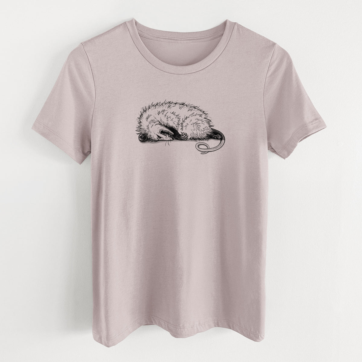 Pink gravel women's relaxed fit cotton t-shirt laid flat, printed with a black ink illustration of an opossum lying on its side playing dead.