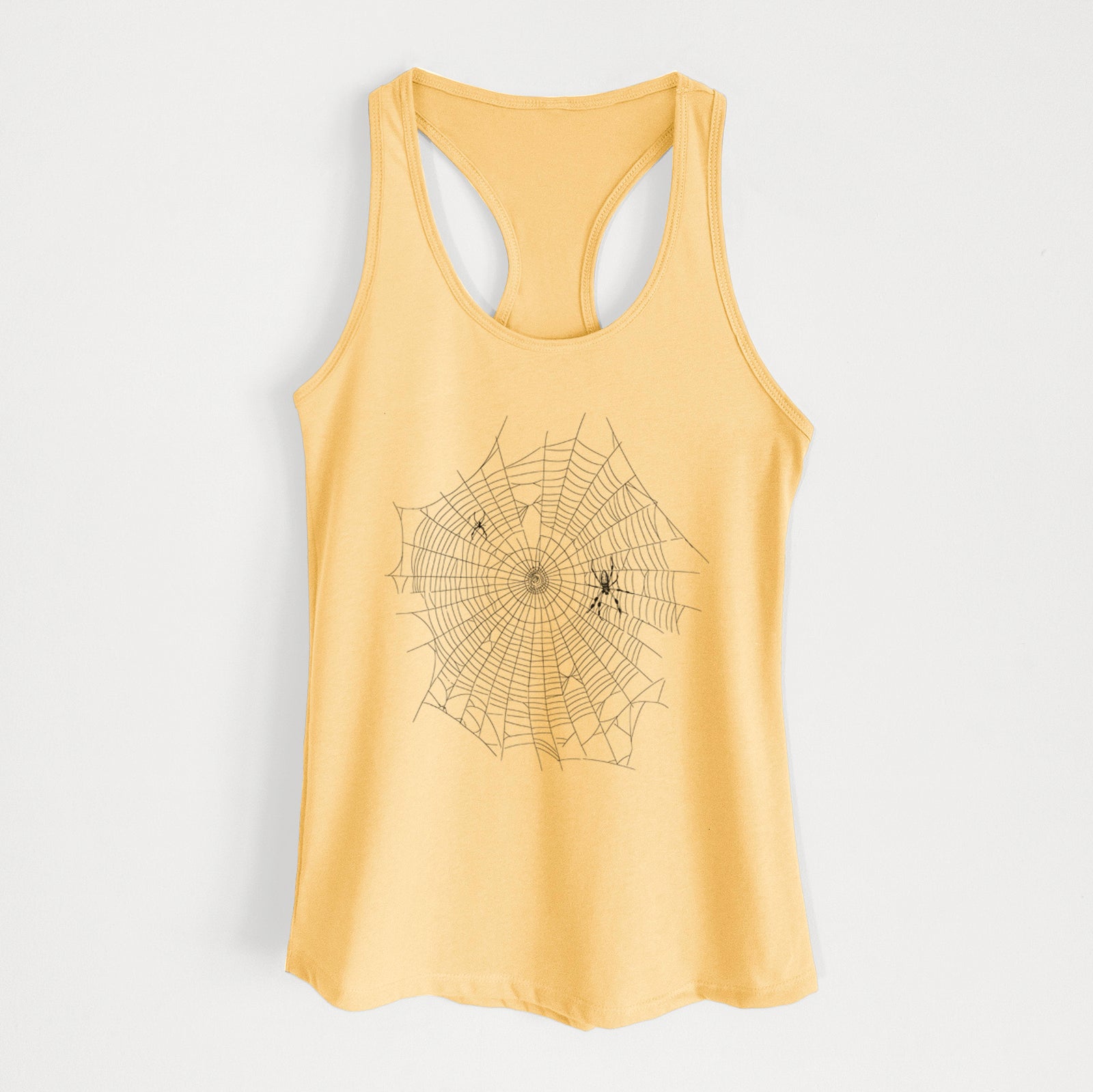 Banana cream women's racerback tank top laid flat, printed with a black ink line drawing of an orb weaver spider in the center of its web.
