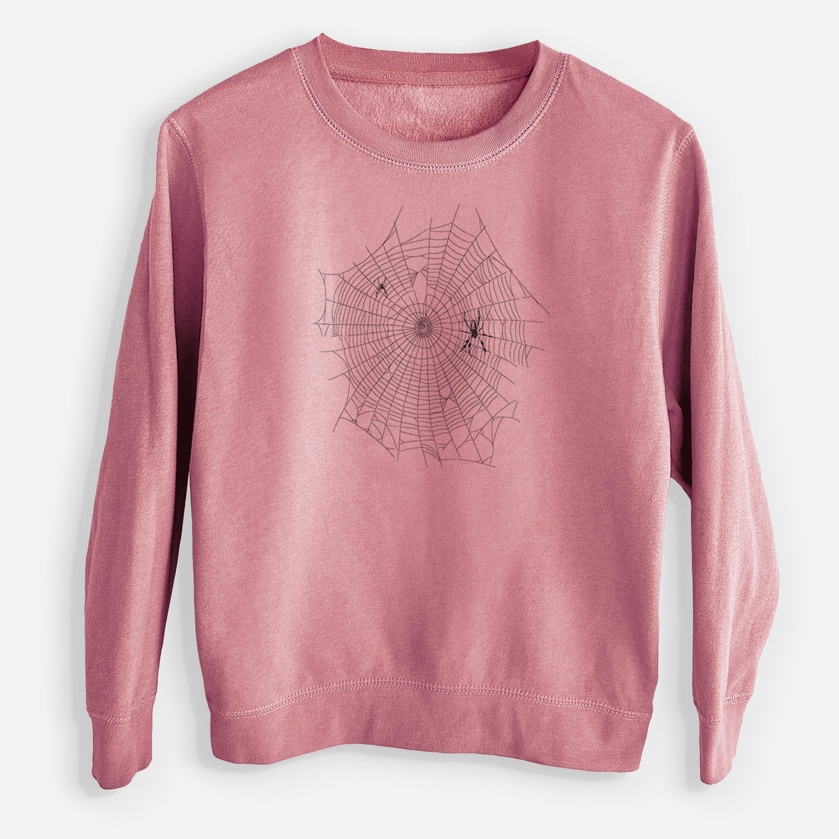 Mauve pink youth crewneck sweatshirt laid flat, printed with a black ink line drawing of an orb weaver spider in the center of its web.