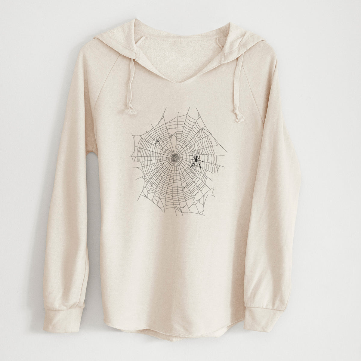 Bone cream women's Cali Wave hooded sweatshirt laid flat, printed with a black ink line drawing of an orb weaver spider in the center of its web.