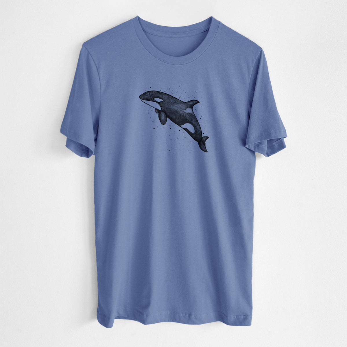 Blue bell lightweight cotton t-shirt laid flat, printed with a black ink illustration of an orca leaping, with ink splatters.