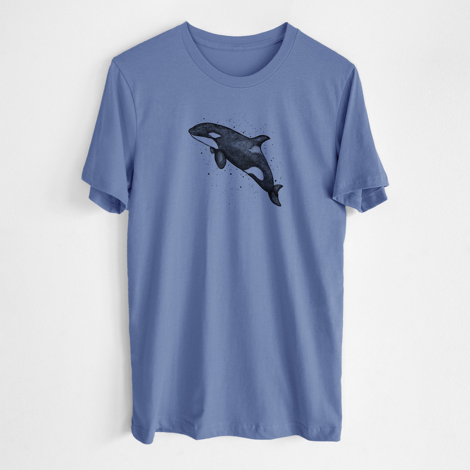 Blue bell lightweight cotton t-shirt laid flat, printed with a black ink illustration of an orca leaping, with ink splatters.