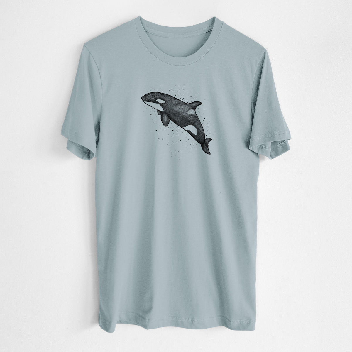 Vintage denim lightweight cotton t-shirt laid flat, printed with a black ink illustration of an orca leaping, with ink splatters.