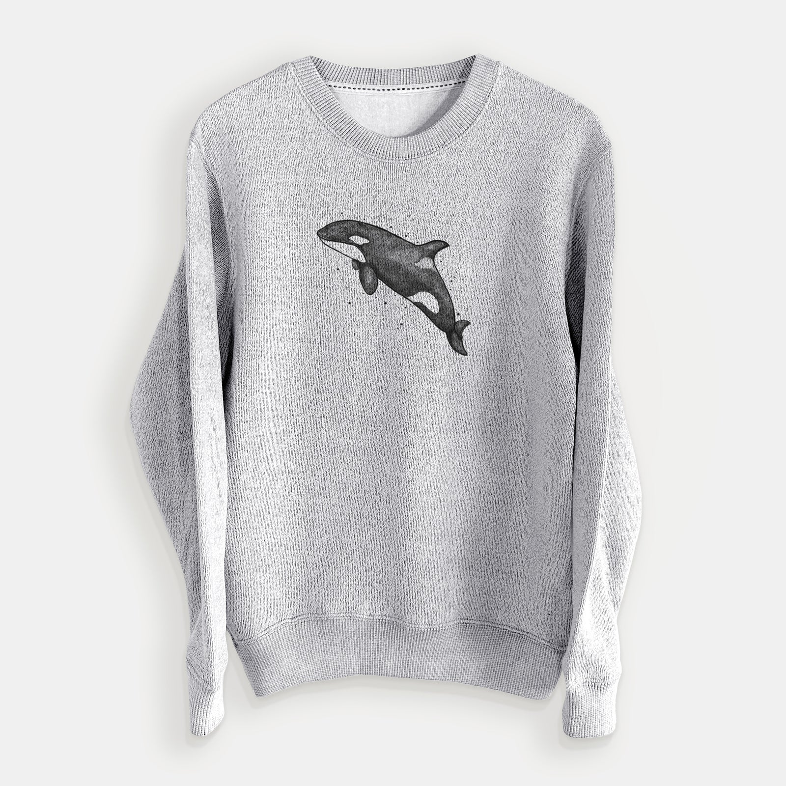 Salt and pepper knit sweatshirt laid flat, printed with a black ink illustration of an orca leaping, with ink splatters.