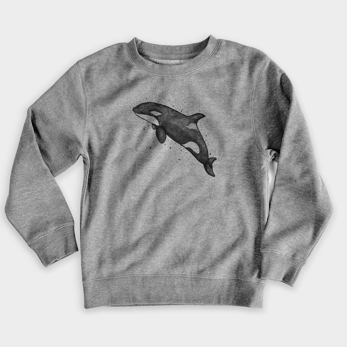 Nickel grey youth crewneck sweatshirt laid flat, printed with a black ink illustration of an orca leaping, with ink splatters.