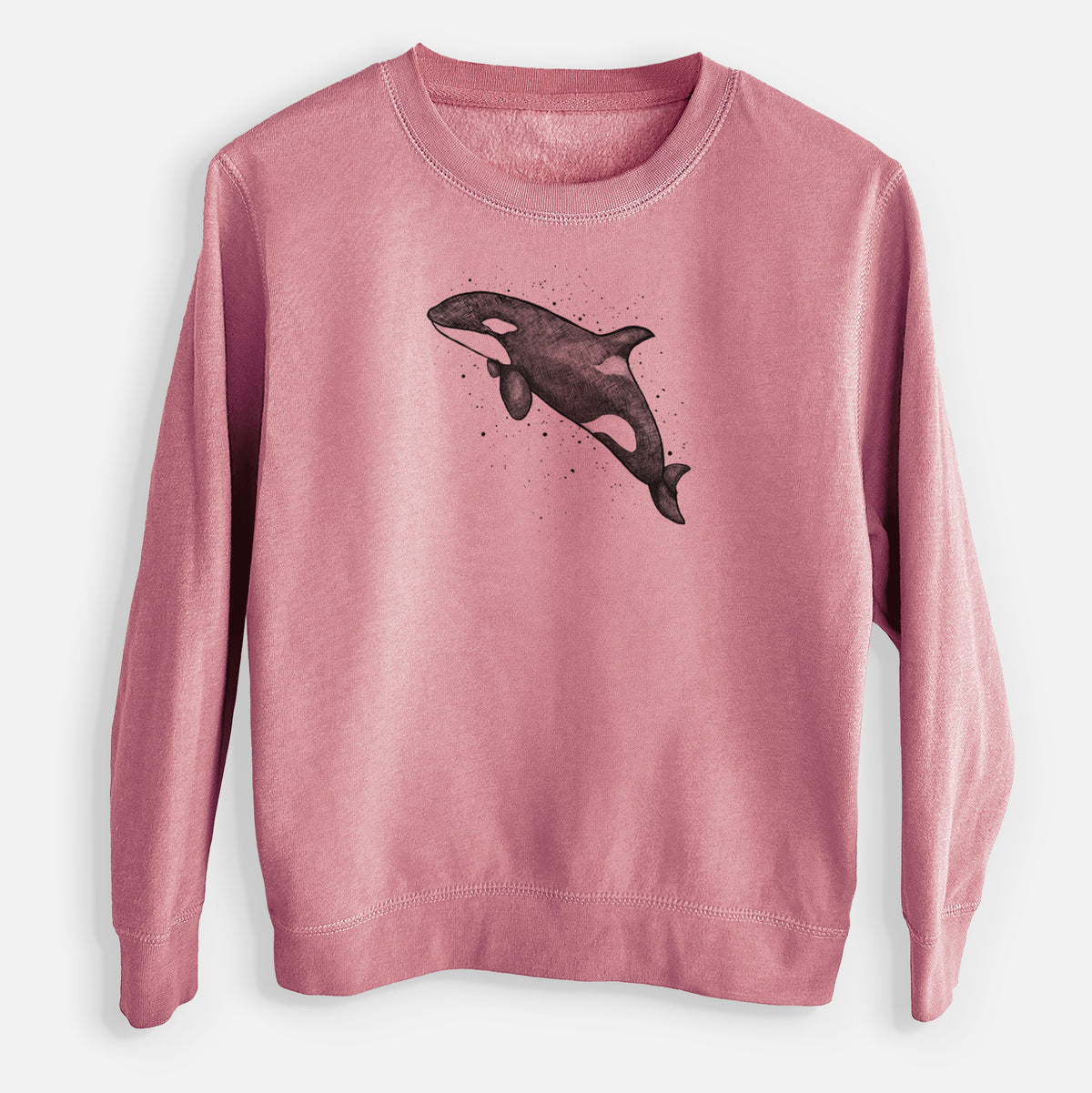 Mauve pink youth crewneck sweatshirt laid flat, printed with a black ink illustration of an orca leaping, with ink splatters.