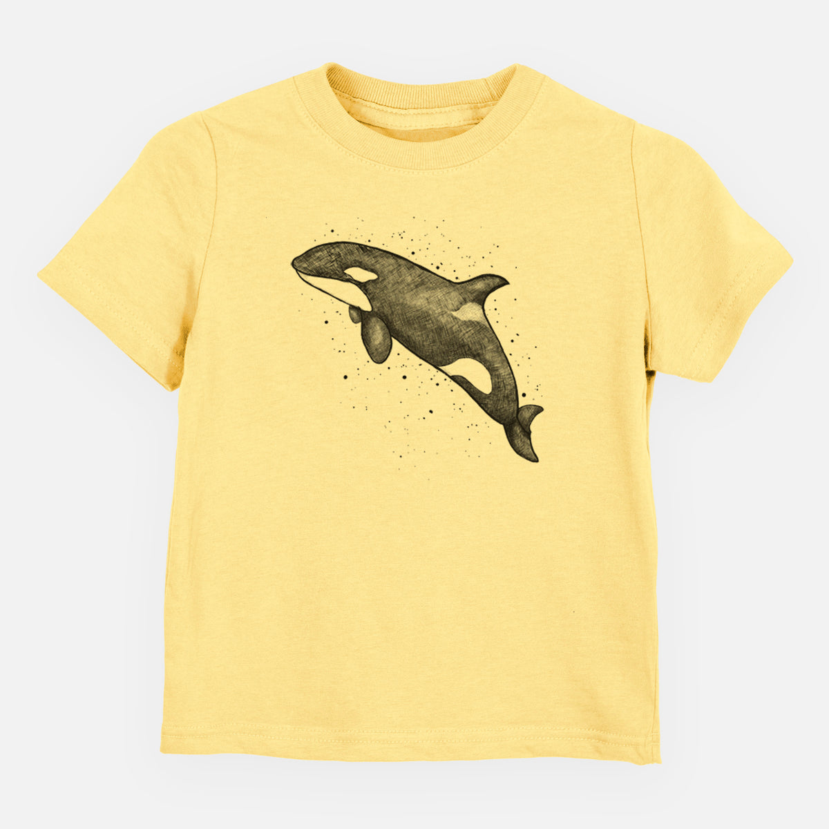 Butter yellow toddler t-shirt laid flat, printed with a black ink illustration of an orca leaping, with ink splatters.