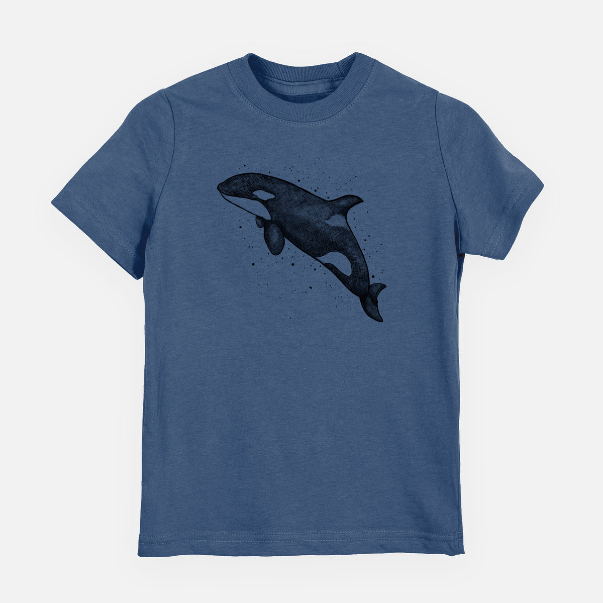 Indigo blue youth t-shirt laid flat, printed with a black ink illustration of an orca leaping, with ink splatters.
