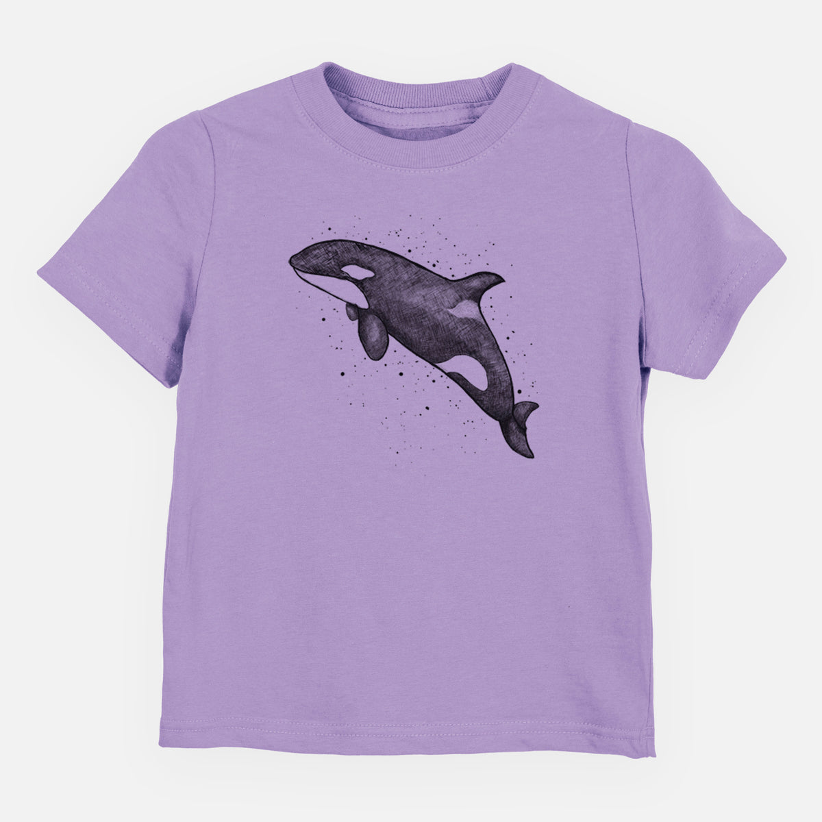 Lavender toddler t-shirt laid flat, printed with a black ink illustration of an orca leaping, with ink splatters.
