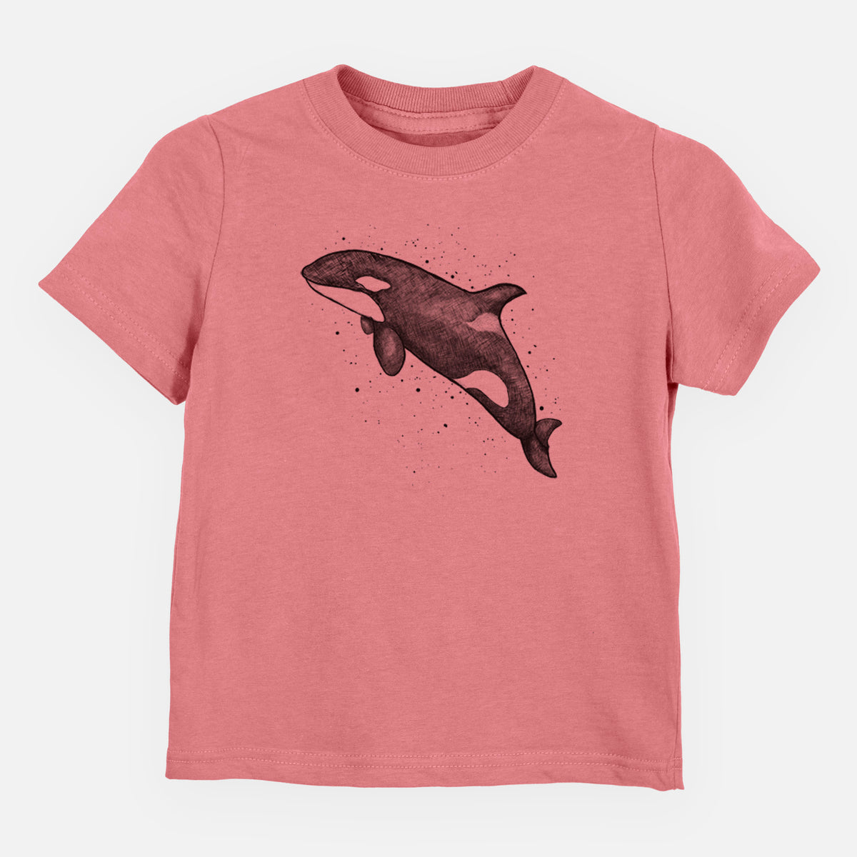 Mauve pink toddler t-shirt laid flat, printed with a black ink illustration of an orca leaping, with ink splatters.