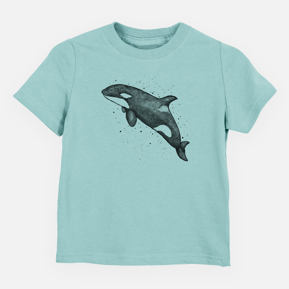 Saltwater toddler t-shirt laid flat, printed with a black ink illustration of an orca leaping, with ink splatters.