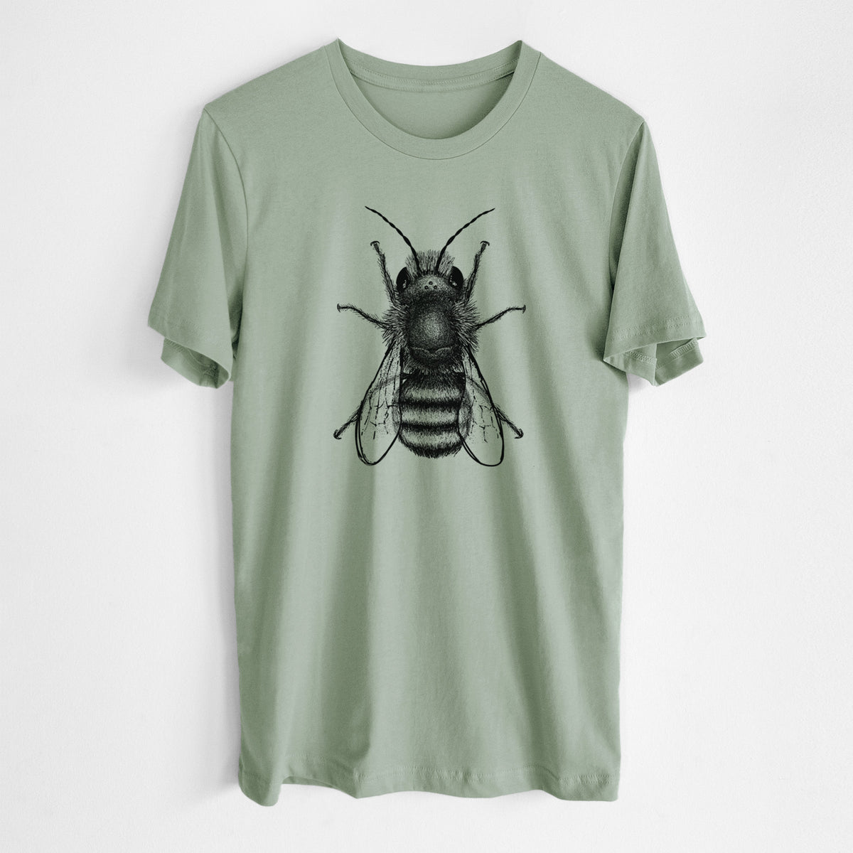 Sage green lightweight cotton t-shirt laid flat, printed with a detailed black ink illustration of a red mason bee with its wings spread, seen from above.