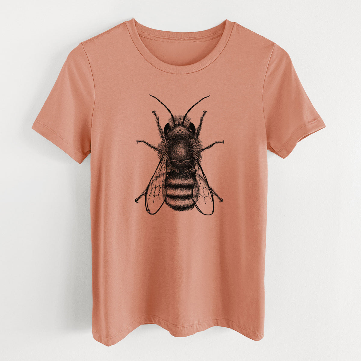 Terracotta orange women's relaxed fit cotton t-shirt laid flat, printed with a detailed black ink illustration of a red mason bee with its wings spread, seen from above.