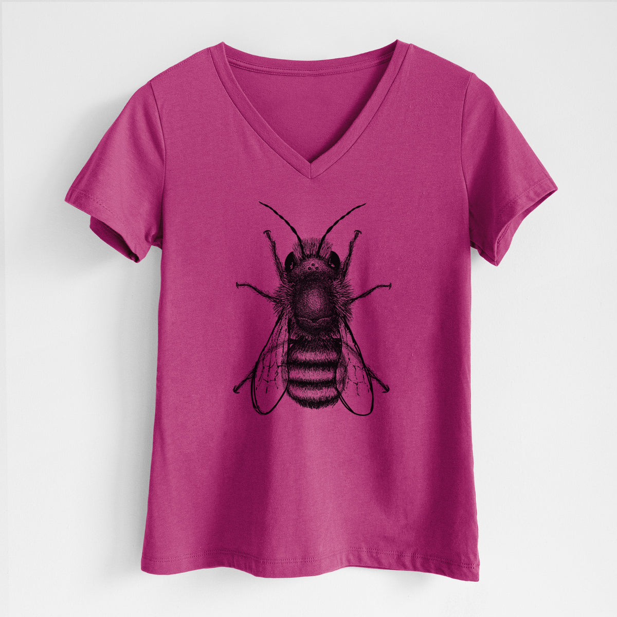 Berry pink women's relaxed fit cotton V-neck t-shirt laid flat, printed with a detailed black ink illustration of a red mason bee with its wings spread, seen from above.
