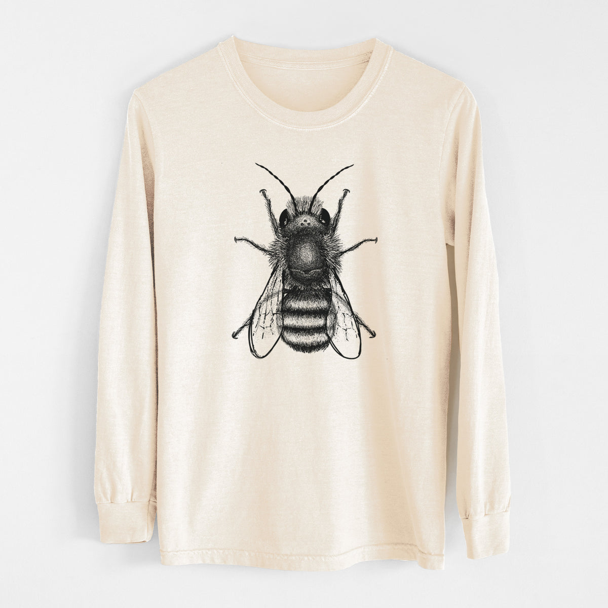 Ivory Comfort Colors long sleeve shirt laid flat, printed with a detailed black ink illustration of a red mason bee with its wings spread, seen from above.