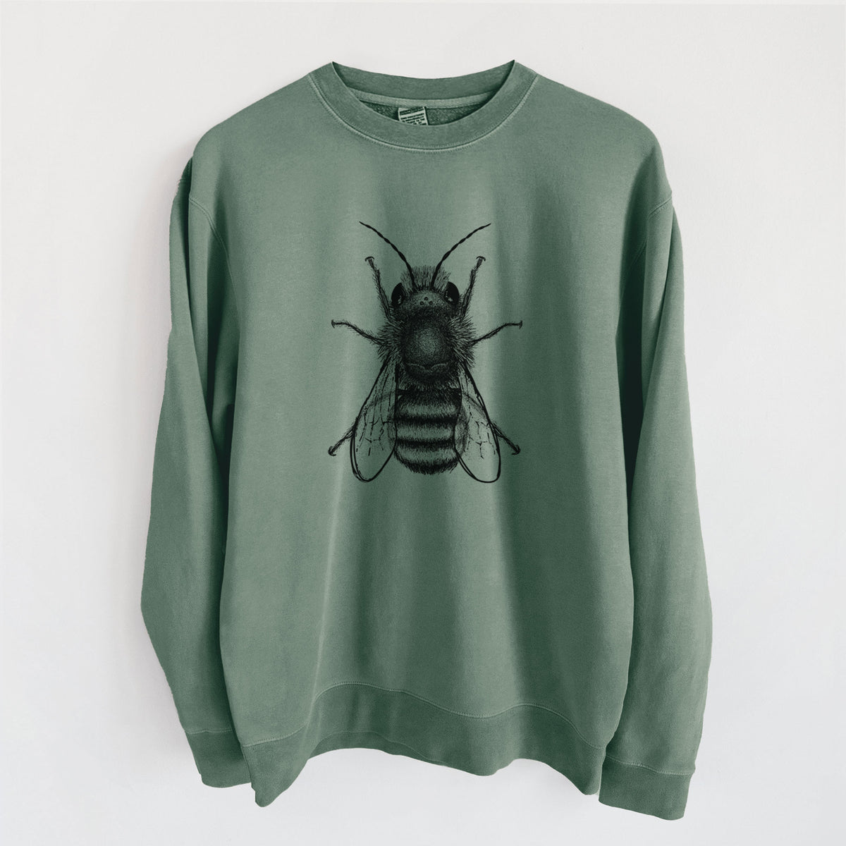 Alpine green pigment dyed crewneck sweatshirt laid flat, printed with a detailed black ink illustration of a red mason bee with its wings spread, seen from above.