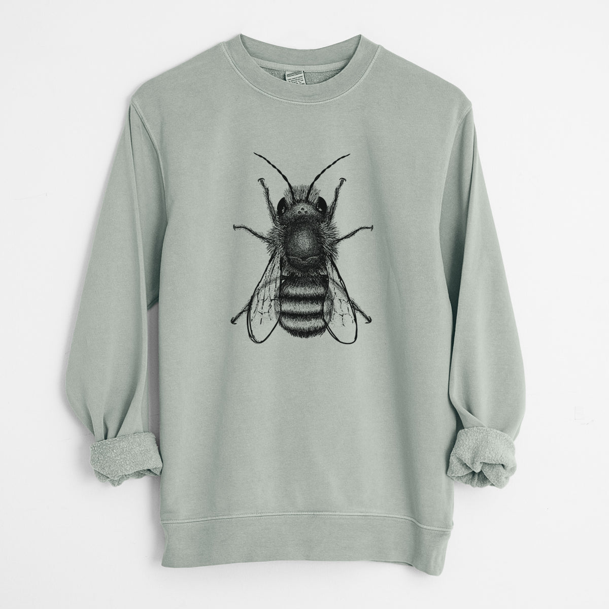 Sage green pigment dyed crewneck sweatshirt laid flat with the sleeves rolled, printed with a detailed black ink illustration of a red mason bee with its wings spread, seen from above.