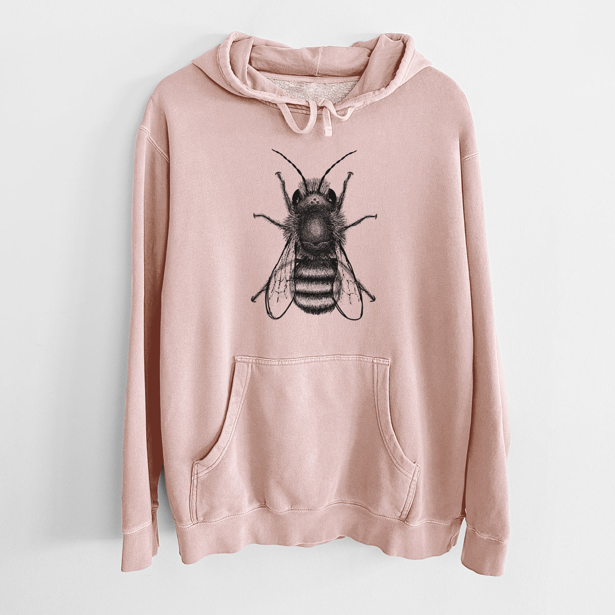 Dusty pink pigment dyed hoodie laid flat, printed with a detailed black ink illustration of a red mason bee with its wings spread, seen from above.