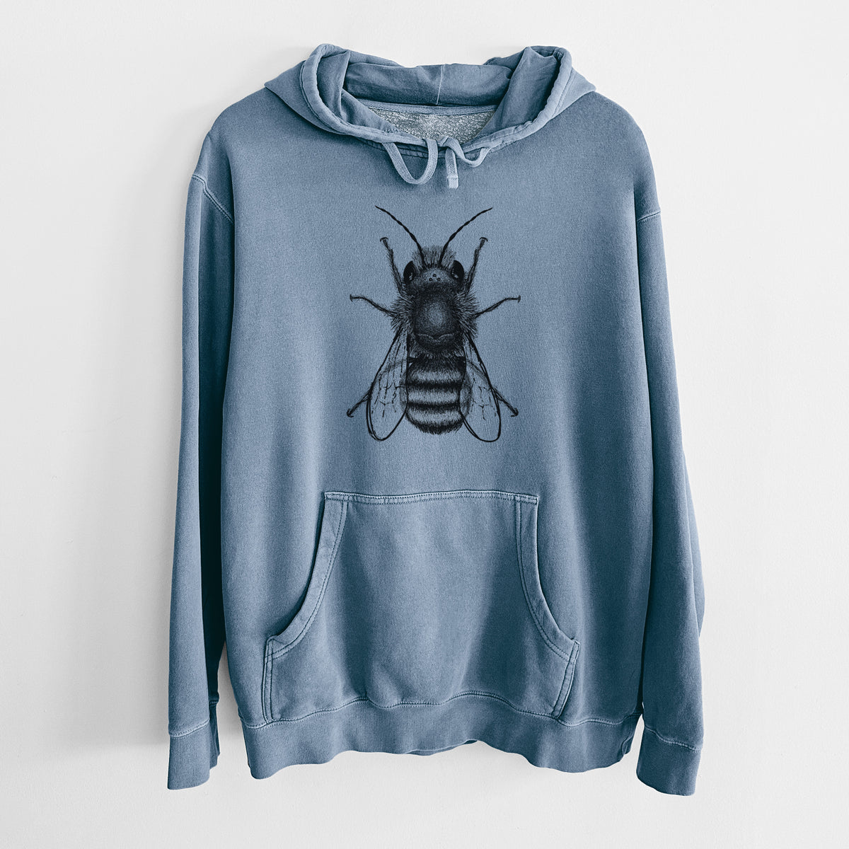 Slate blue pigment dyed hoodie laid flat, printed with a detailed black ink illustration of a red mason bee with its wings spread, seen from above.