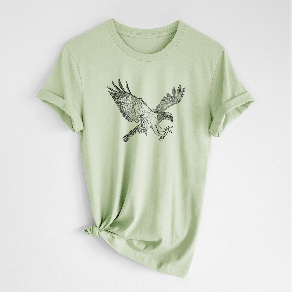 Spring green lightweight cotton t-shirt laid flat with the sleeves rolled, printed with a black ink illustration of an osprey in flight with its wings spread.