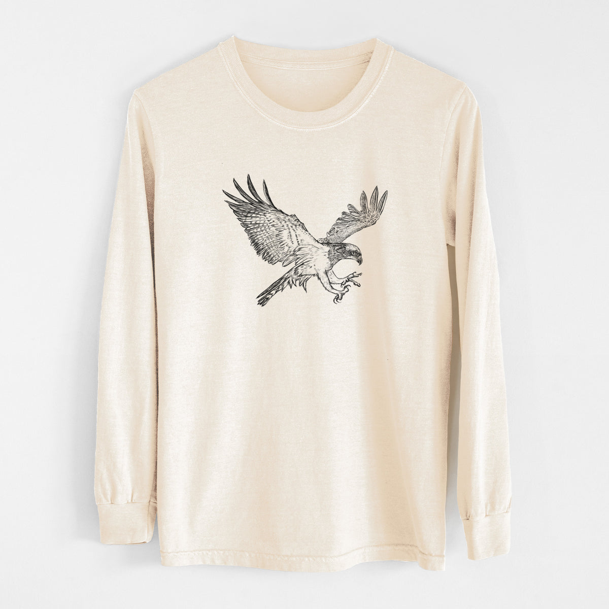 Ivory Comfort Colors long sleeve shirt laid flat, printed with a black ink illustration of an osprey in flight with its wings spread.