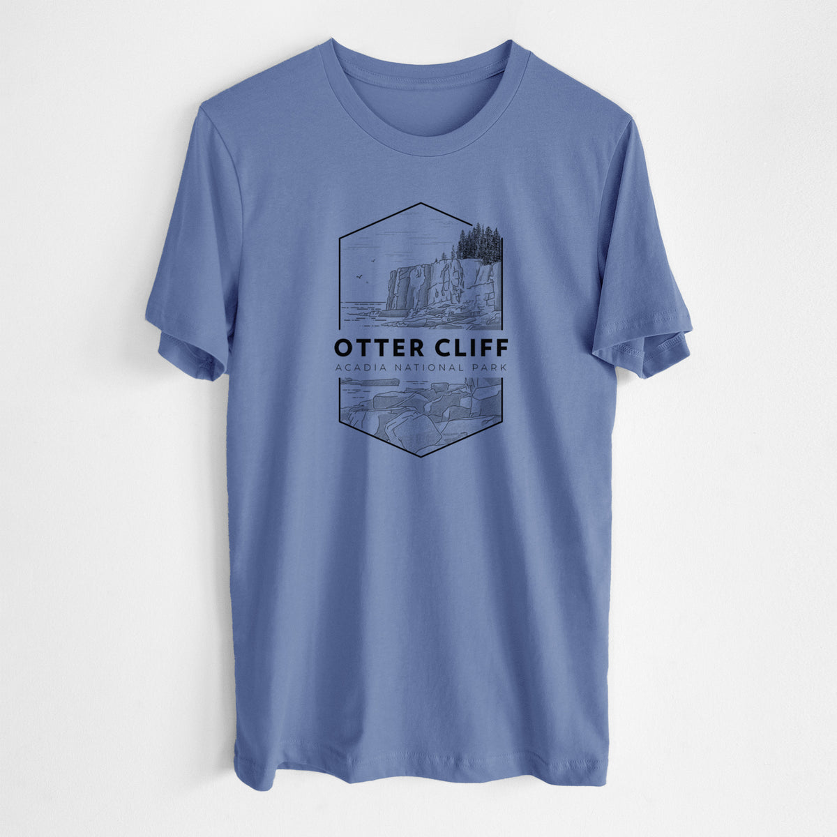 Blue bell lightweight cotton t-shirt laid flat, printed with a black line art badge of Otter Cliff above the ocean, with the words Otter Cliff, Acadia National Park.