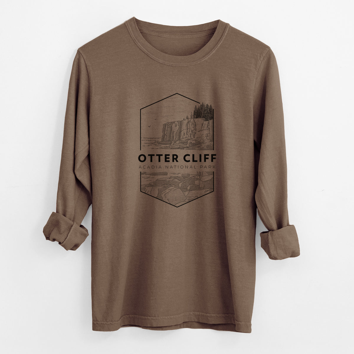 Espresso brown Comfort Colors long sleeve shirt laid flat with the cuffs rolled, printed with a black line art badge of Otter Cliff above the ocean, with the words Otter Cliff, Acadia National Park.