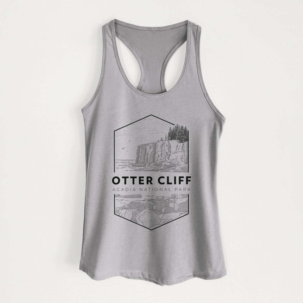 Heather grey women's racerback tank top laid flat, printed with a black line art badge of Otter Cliff above the ocean, with the words Otter Cliff, Acadia National Park.
