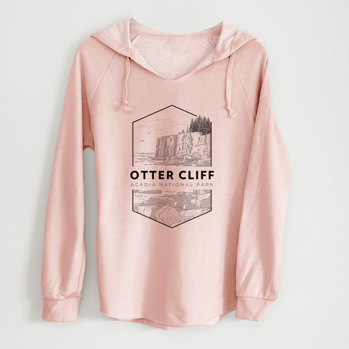 Blush pink women's Cali Wave hooded sweatshirt laid flat, printed with a black line art badge of Otter Cliff above the ocean, with the words Otter Cliff, Acadia National Park.