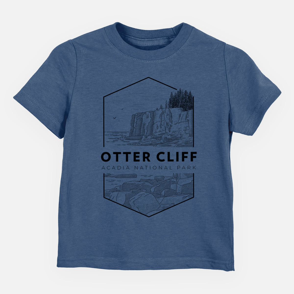 Indigo blue toddler t-shirt laid flat, printed with a black line art badge of Otter Cliff above the ocean, with the words Otter Cliff, Acadia National Park.